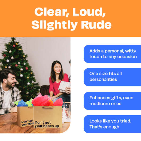 Funny gift bag with witty text, enhancing gifts for any occasion, underneath a Christmas tree.