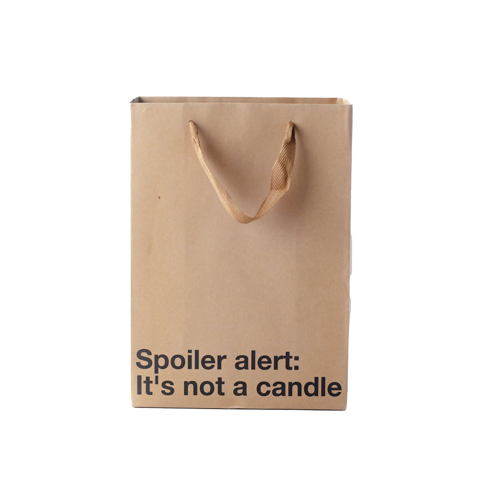 Funny gift bag with the text 'Spoiler alert: It's not a candle' on a kraft material with brown ribbon handle.