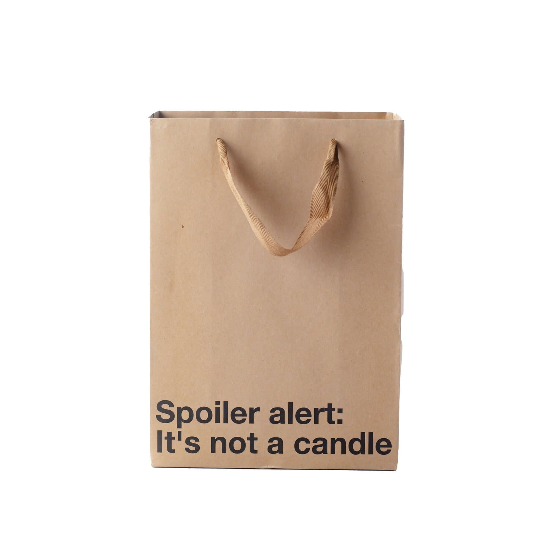 Funny gift bag with the text 'Spoiler alert: It's not a candle' on a kraft material with brown ribbon handle.
