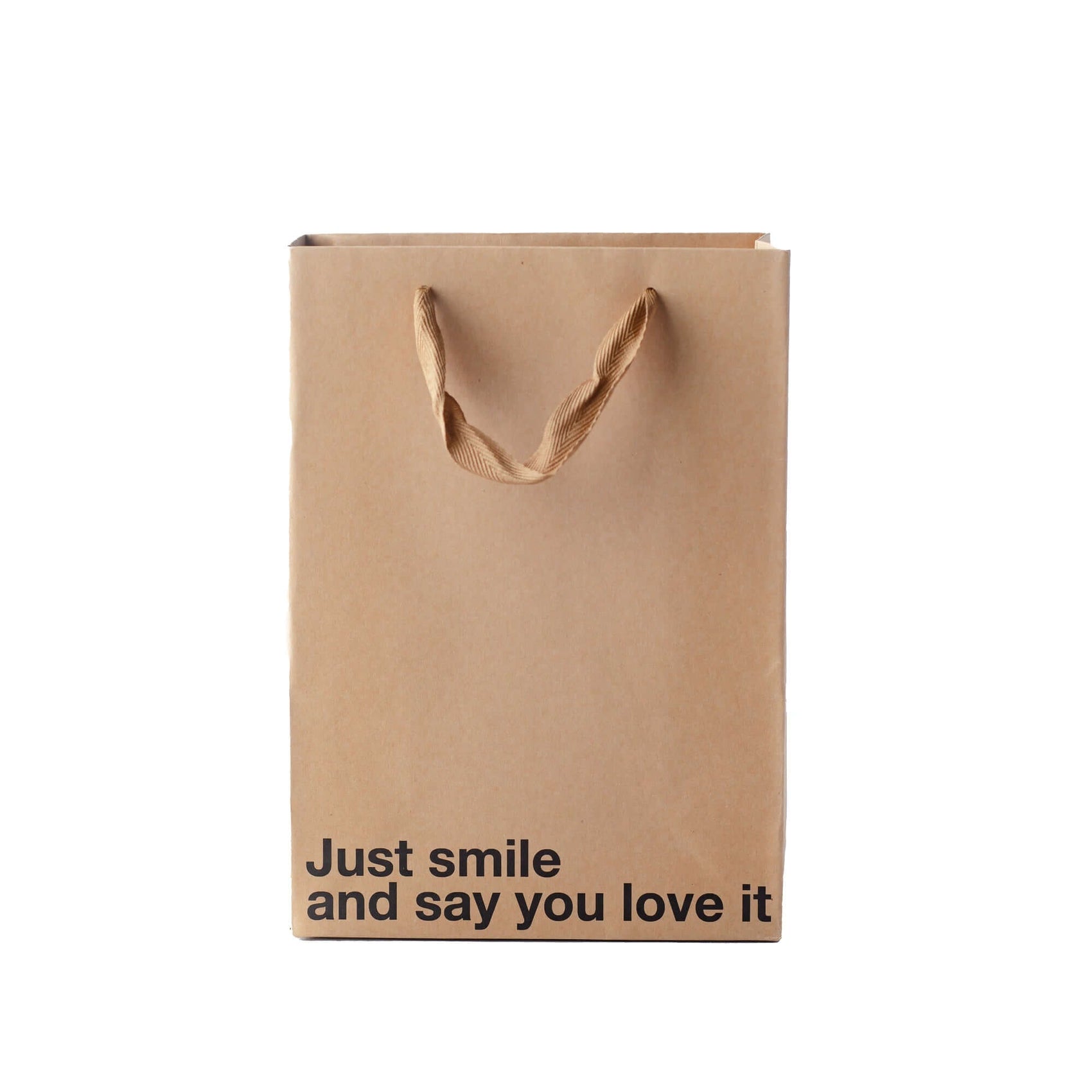 Just Smile gift bag made of kraft material with brown ribbon handle, featuring the text 'Just smile and say you love it', funny gift bag.