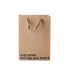 Just Smile gift bag made of kraft material with brown ribbon handle, featuring the text &