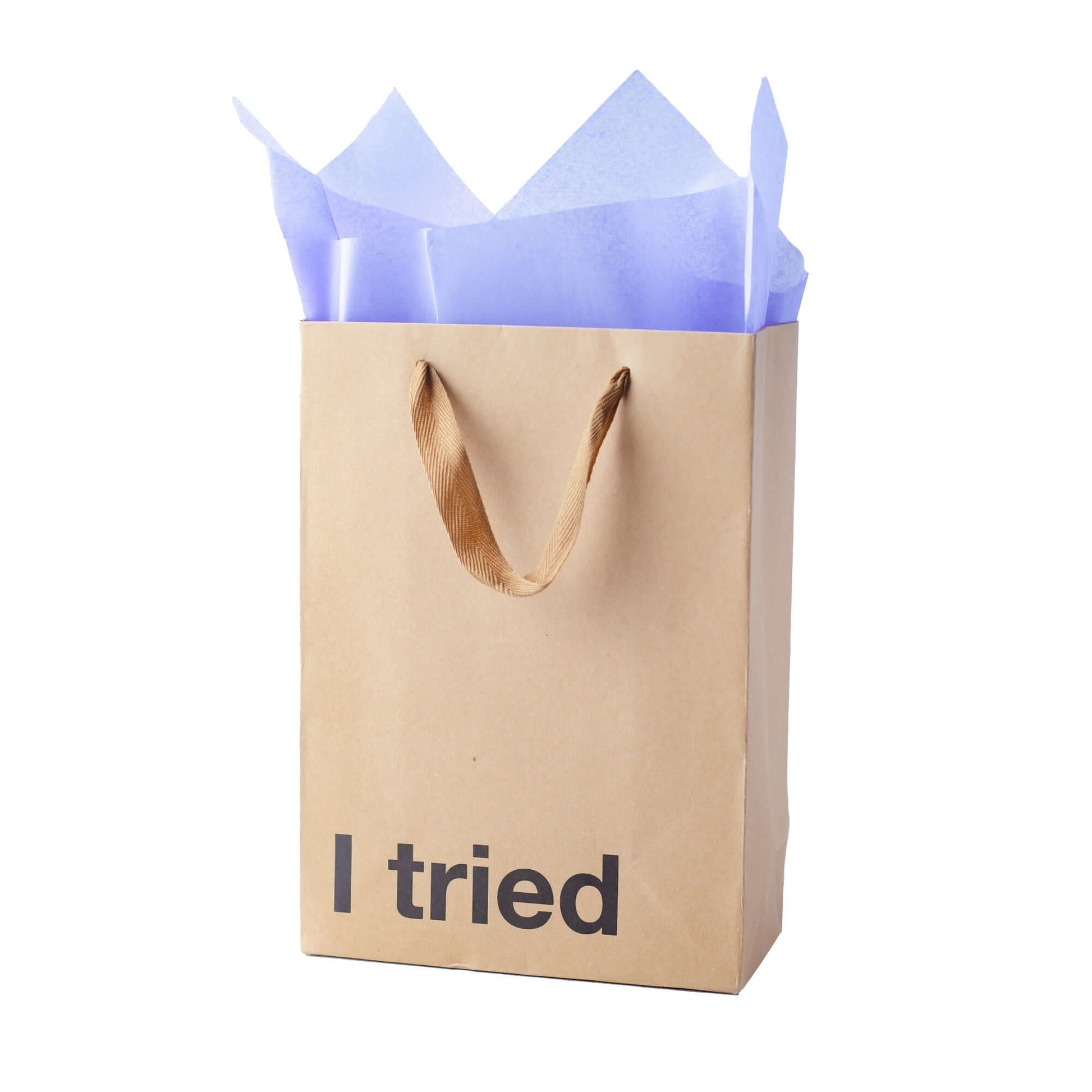 Funny gift bag with 'I tried' text in black on kraft paper, featuring blue tissue paper inside.