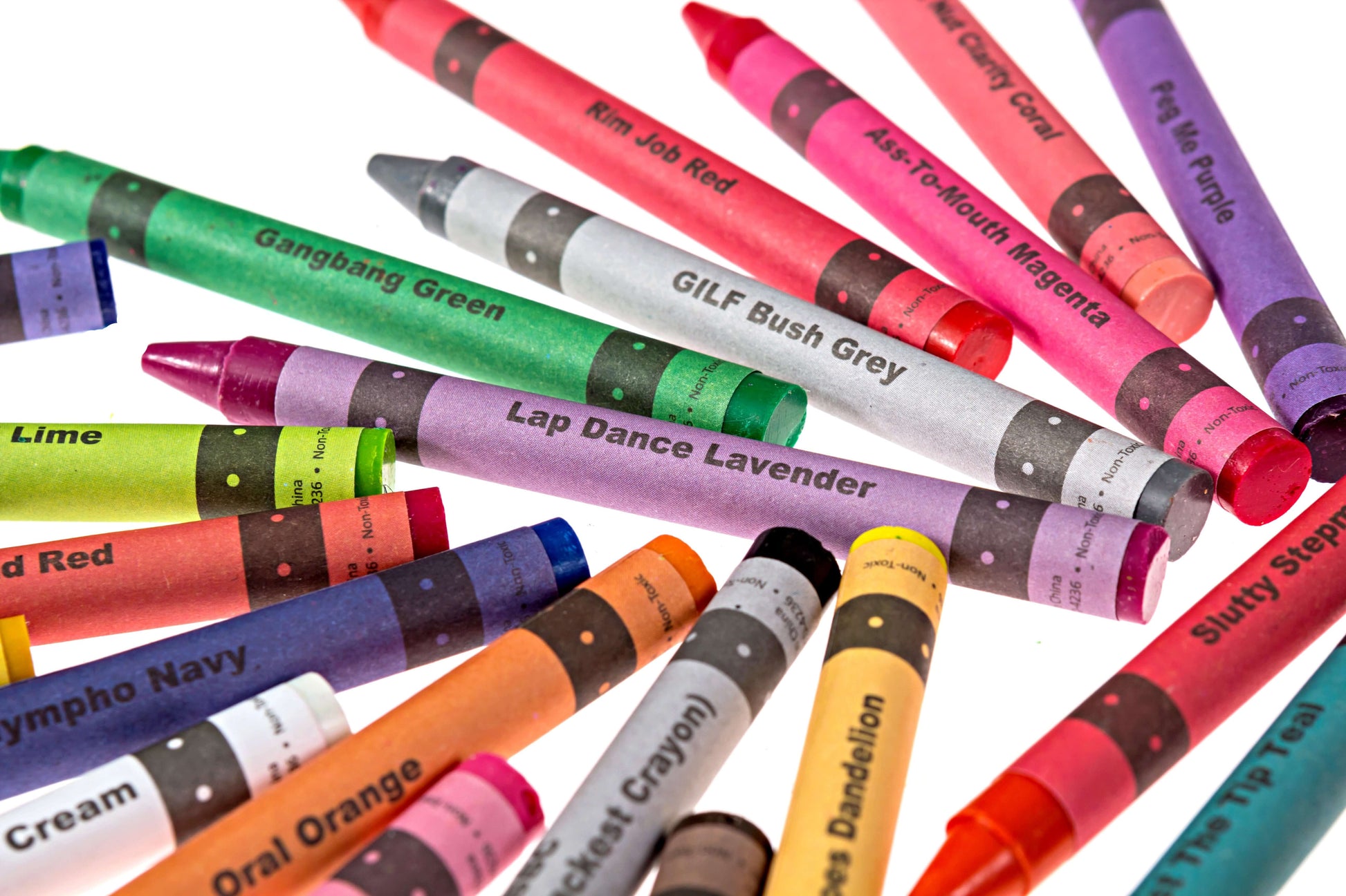 Offensive crayons in various colors, including Gangbang Green and Lap Dance Lavender, adding humor to creative projects.
