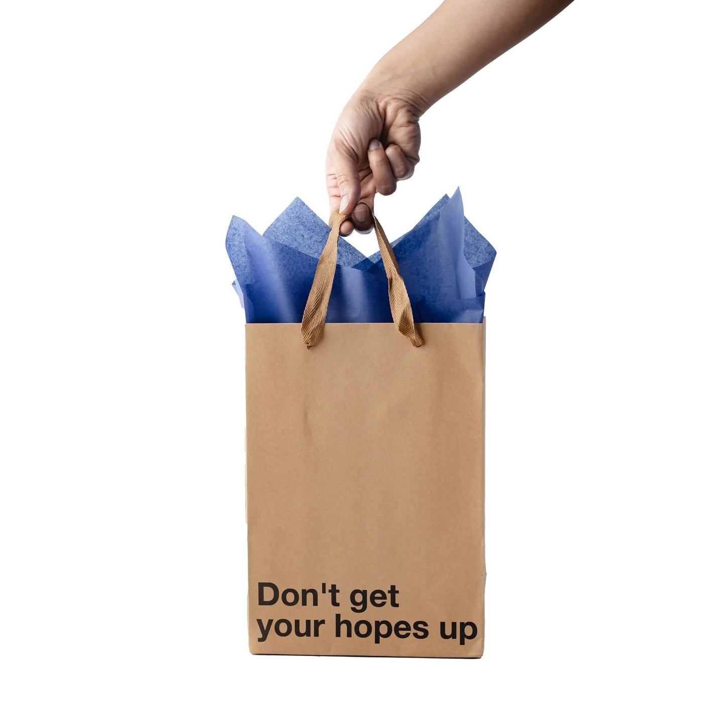 Funny gift bag featuring the phrase 'Don't get your hopes up' with blue tissue paper and brown ribbon handles.