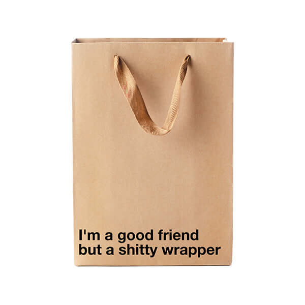 Funny gift bag with the phrase "I'm a good friend but a shitty wrapper" for humorous gifting.