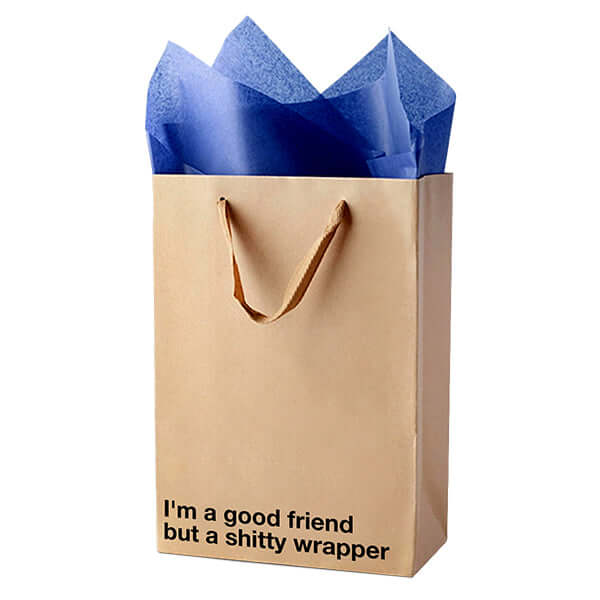 Funny gift bag with the phrase "I'm a good friend but a shitty wrapper" and blue tissue paper for bold gifting.