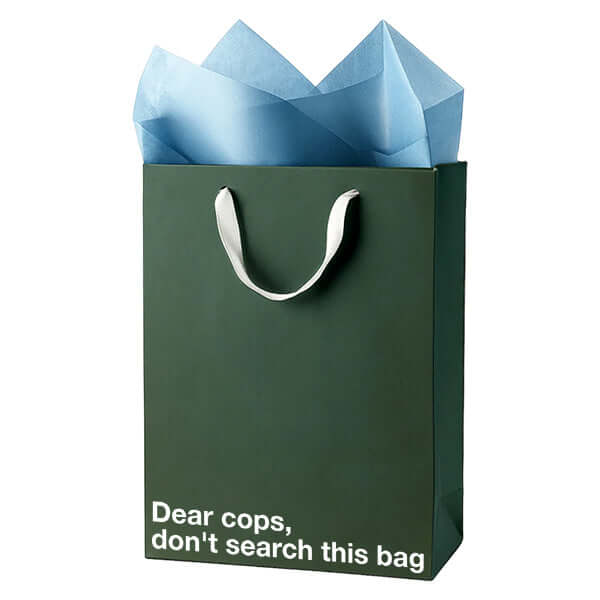 Funny gift bag with the text 'Dear cops, don't search this bag' and blue tissue paper inside, perfect for stoner humor.
