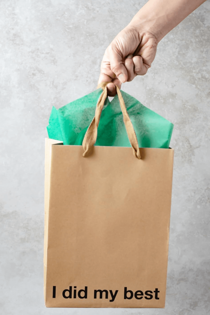 Funny gift bags featuring a kraft bag with the text 'I did my best' and colorful tissue paper inside.