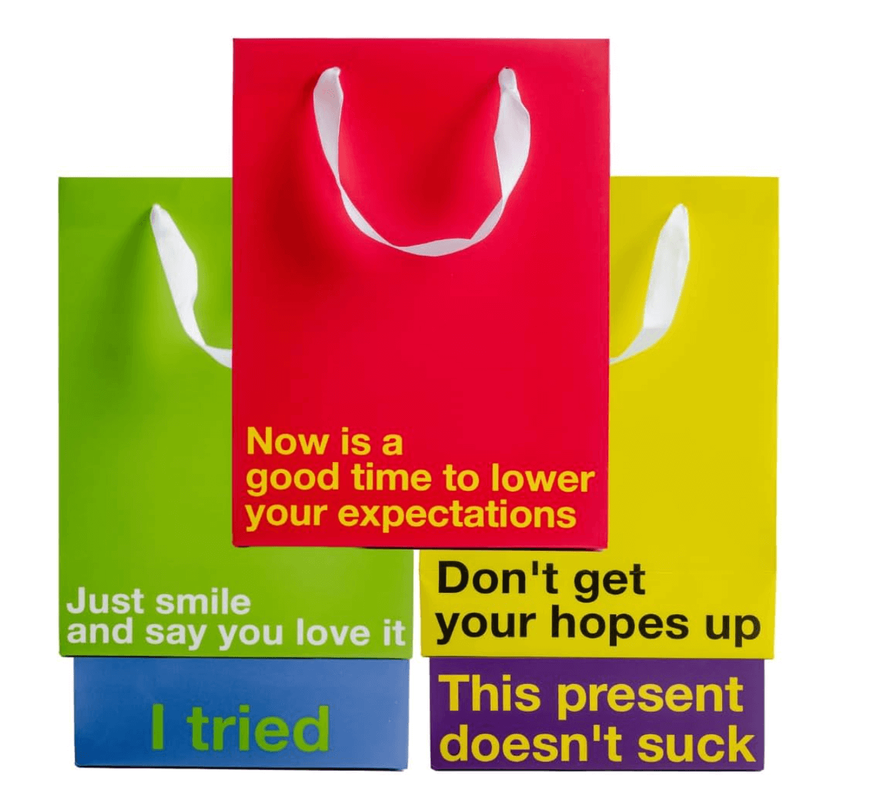 Colored gift bag set featuring funny gift bags with humorous slogans about expectations and presents.
