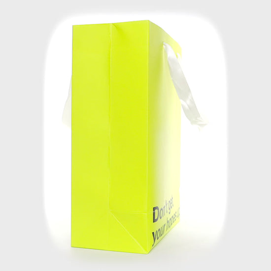 "Don't Get Your Hopes Up" yellow gift bag – Funny, snarky kraft gift bag with white ribbon.