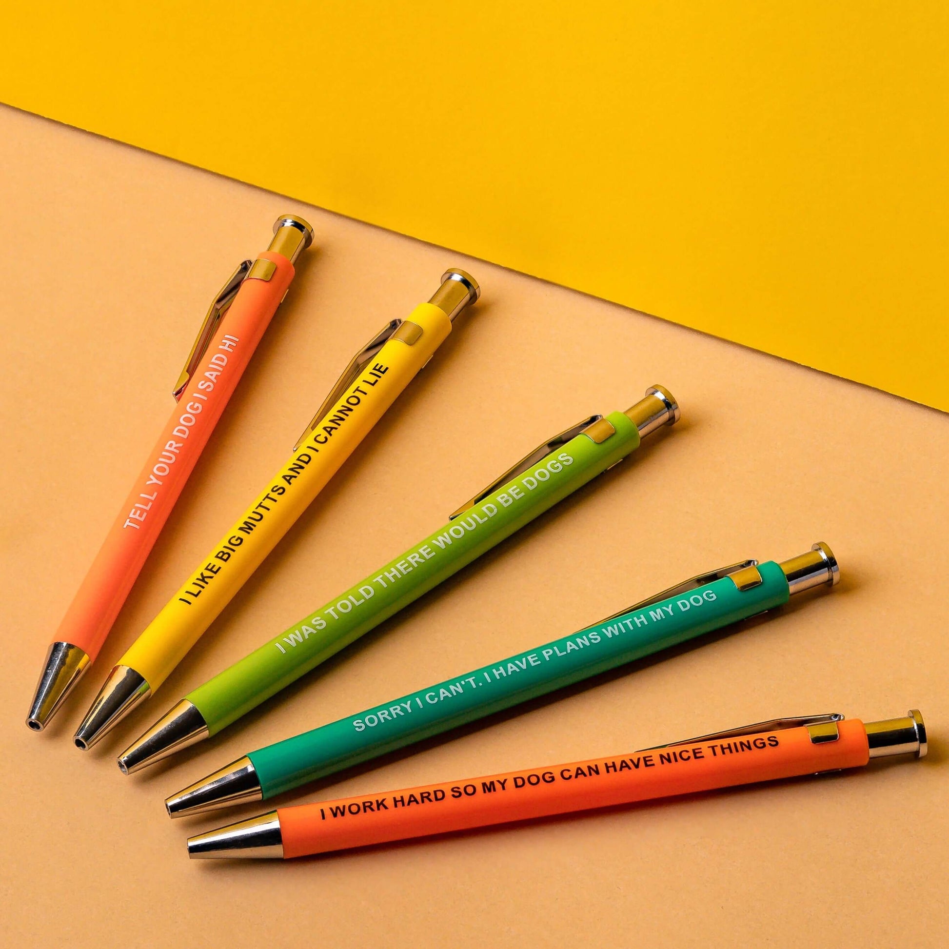 Colorful funny pens with humorous dog phrases for dog lovers.