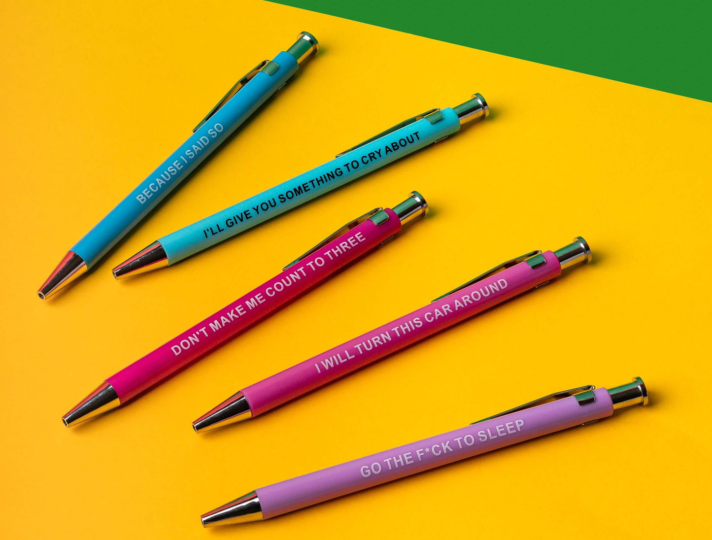 Funny pens featuring sarcastic phrases like 'Because I said so' and 'Go the f*ck to sleep' on colorful backgrounds.