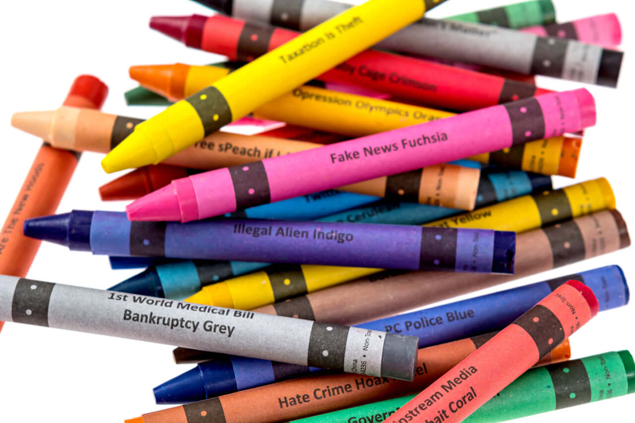 A collection of Offensive Crayons featuring politically themed colors like Fake News Fuchsia and Bankruptcy Grey.